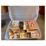 (LR)ï¿½Childrenï¿½s Books in Plastic Bin
