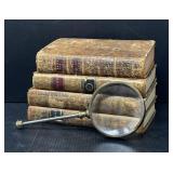 Antique Books and Magnifying Glass