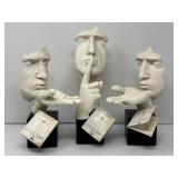 Three Face and Hand Sculptures