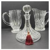 Two Crystal Pitchers and One Decanter