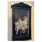 Doll in Display Cabinet