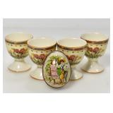 4 EGG HOLDERS AND SMALL TIN EGG