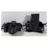MINOLTA MAXXUM 7000 SLR CAMERA AND LENS