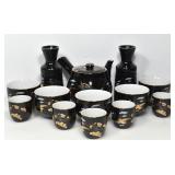 BLACK AND GOLD-TONED PORCELAIN TEA SET