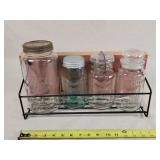 4 Antique Jars on Barn Wood Wall Mount