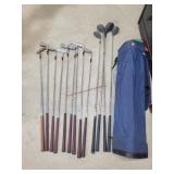 Set of Golf Clubs in Blue Golf Bag