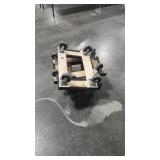 FOUR SMALL CARPETED MOVING DOLLIES