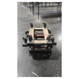 FOUR SMALL CARPETED MOVING DOLLIES