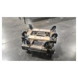 FOUR SMALL CARPETED MOVING DOLLIES