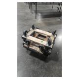 FOUR SMALL CARPETED MOVING DOLLIES