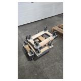 FOUR SMALL CARPETED MOVING DOLLIES