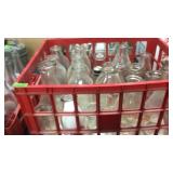 RED BASKET OF MILK BOTTLES