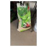 PARTIAL BAG OF WILD BIRD FOOD & GROUP OF STORAGE