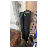 PARTIAL ROLL OF BLACK PLASTIC