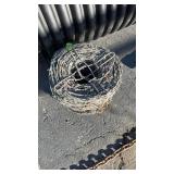 NEW ROLL OF BARBED WIRE