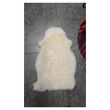 2 SMALL SHEEPSKIN RUGS