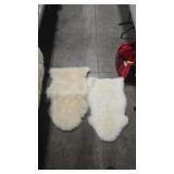 2 SMALL SHEEPSKIN RUGS