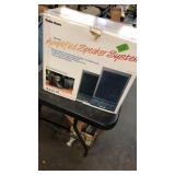 AMPLIFIED SPEAKER SYSTEM