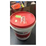 CONTAINER OF DOUBLE BARBED FENCE STAPLES