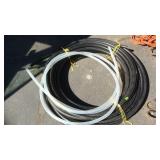 ROLL OF BLACK POLY PIPE, CLEAR PIPE