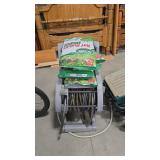 HOSE REEL AND 5 BAGS OF LAWN FOOD