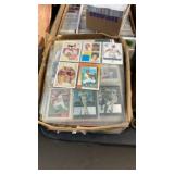 BX OF SPORTS CARDS IN PLASTIC SHEETS