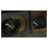 2 EXTENSION CORDS & BX OF MISC PLUMBING PARTS