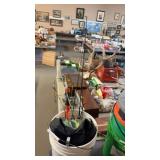 BUCKET W/ 6 ICE FISHING POLES, LADLE & MISC