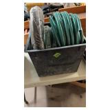 GROUP OF HOSE IN BLACK TUB