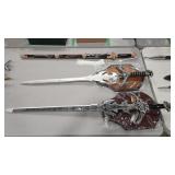 2 WALL MOUNT DECORATIVE SWORDS AND 1 W/ SHEATH