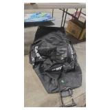 EATON ROLLING DUFFEL BAG W/ LADIES HOCKEY GEAR