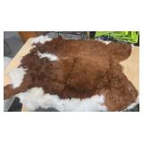 BROWN AND WHITE COWHIDE RUG