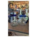 2 BLUE RIM PITCHERS