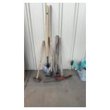 ASSORTED PICK AXES, RAKE, SHOVEL AND SLEDGE HAMMER