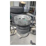 4 COOPER 225/65R17 TIRES ON CHRYSTLER WHEELS