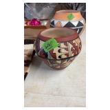 JEMEZ PUEBLO POTTERY VASE FETURUING A POLY CHROME