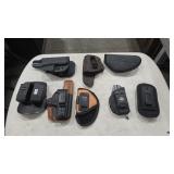 GROUP OF ASSORTED PISTOL HOLSTERS AND MAG HOLDERS
