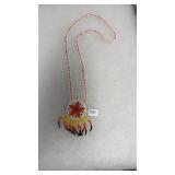 BEADED NECKLACE W/ ORANGE STAR IN CENTER