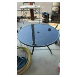 METAL AND GLASS PATIO TABLE 4' WIDTH
