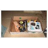 GROUP OF TAPE MEASURERS AND BOX CUTTERS, AND YAK
