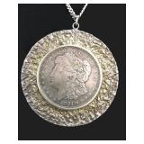 FRAMED 1921 MORGAN HEAD SILVER DOLLAR ON CHAIN