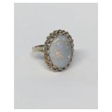 OVAL CABOCHON FIRE OPAL IN 14KT YELLOW GOLD RING