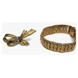 7" 18KT YELLOW GOLD HINGED BRACELET & KNOT BROOCH