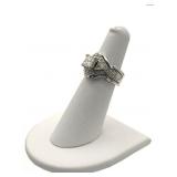PRINCESS CUT DIAMOND RING FLANKED BY TRILLIAN