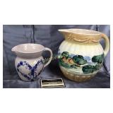Old pottery pitcher with chip and marshal pottery