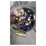 Costume jewelry and beads in plastic footed bowl