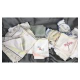 Embroidery and other hand done linens in glass