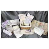 Basket of hand done embroidery and linens-pillow