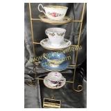 4 cups and saucers stand not included