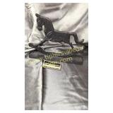 Cast iron rocking horse door stop